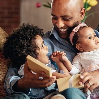 Father reading with his children