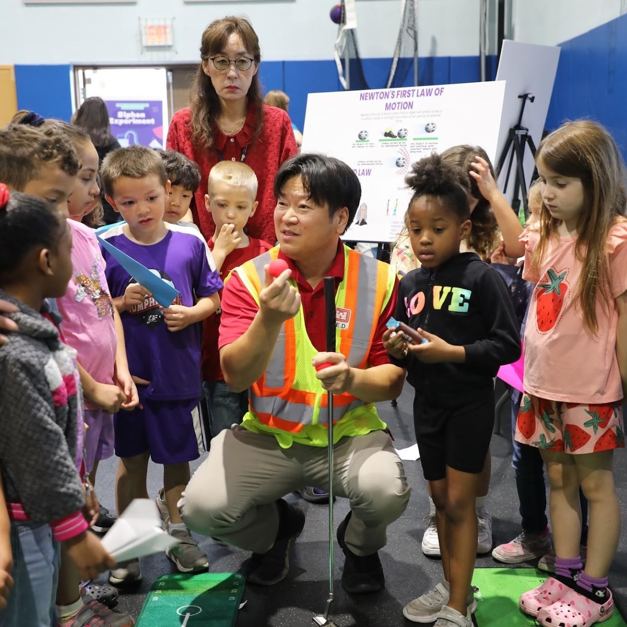 Educator engaging a group of young students